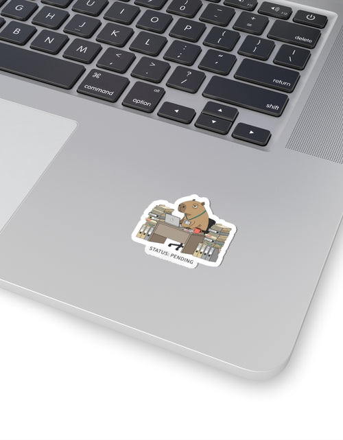 Load image into Gallery viewer, Status: Pending — Raccoon at Desk Kiss-Cut Sticker | Unhinged Animal Bureaucracy
