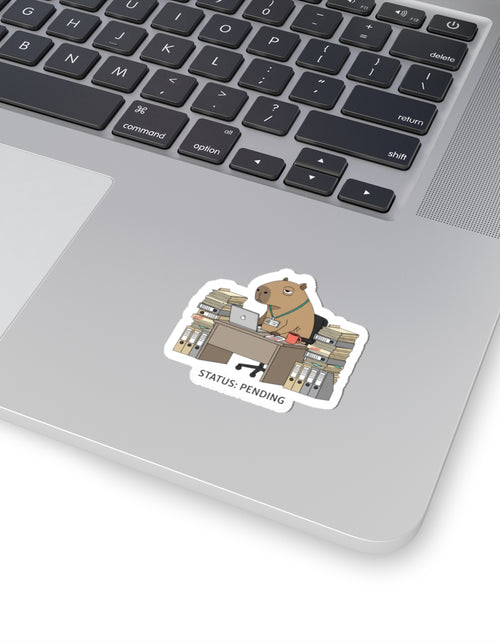 Load image into Gallery viewer, Status: Pending — Raccoon at Desk Kiss-Cut Sticker | Unhinged Animal Bureaucracy

